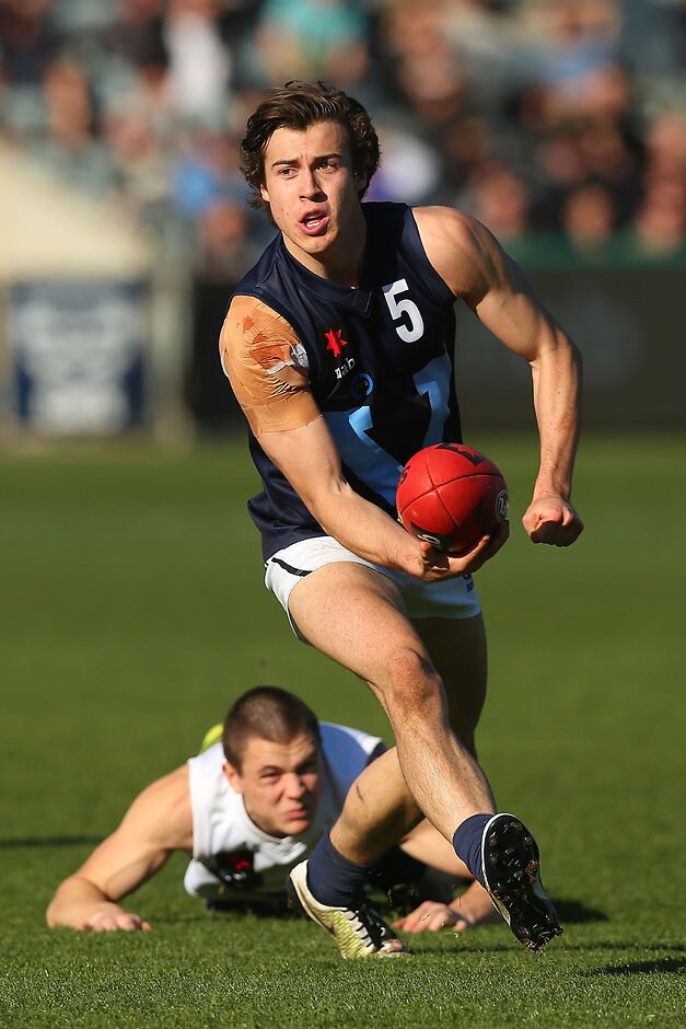 AFL 2016 U18 CHAMPIONSHIPS - Vic Metro v Vic Country GEELONG, AUSTRALIA - JUNE 13: Andrew McGrath of Vic Metro handballs during the Under 18's AFL match between Vic Country and Vic Metro at Simonds Stadium on June 13, 2016 in Geelong, Australia. (Photo by Graham Denholm/AFL Media)